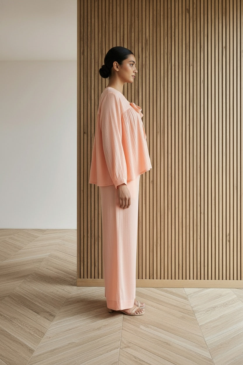 Side profile of the model wearing Fuzzy Peach Loungewear | Organic Cotton | Women